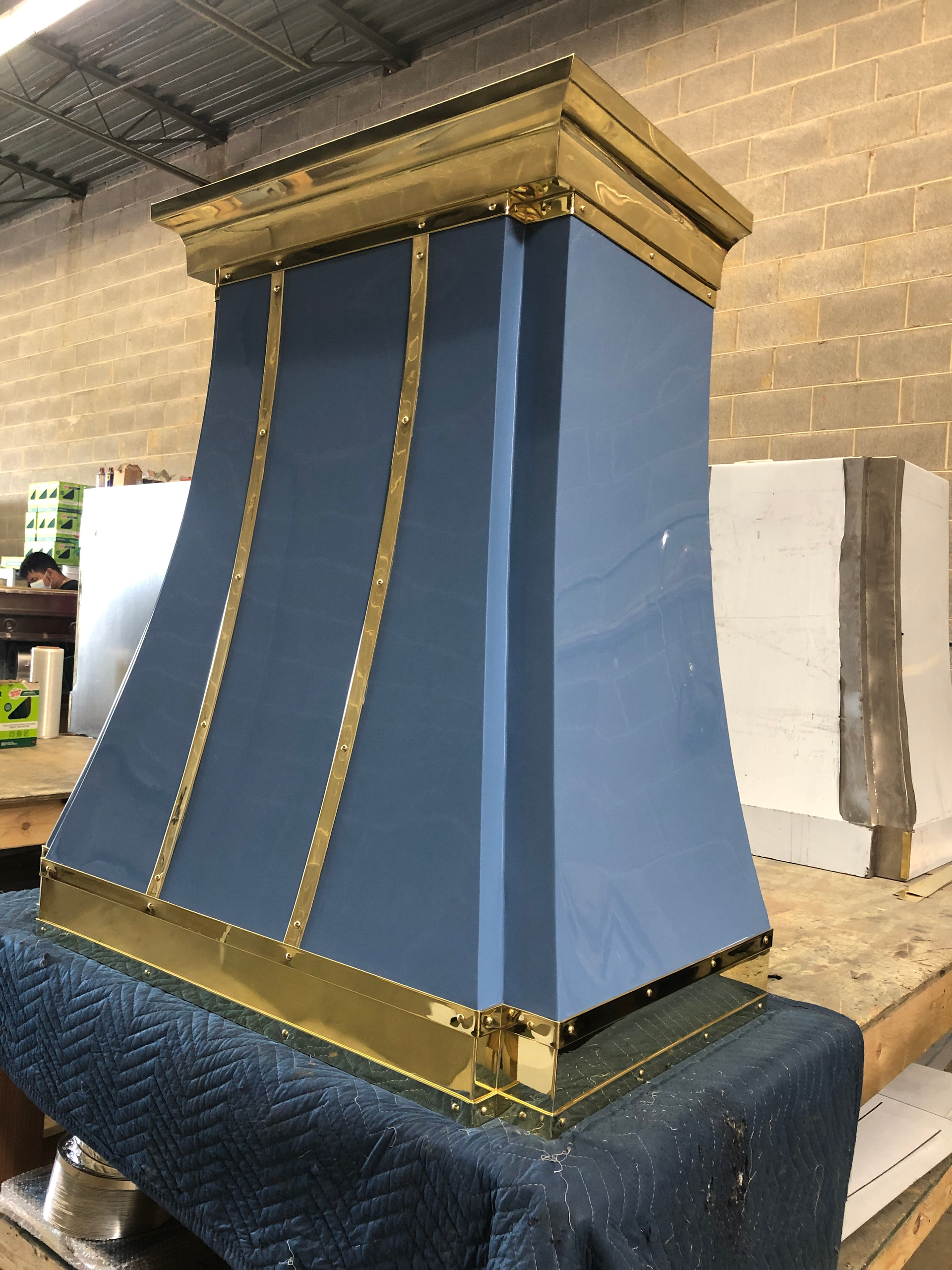 A blue and gold item is sitting on a table