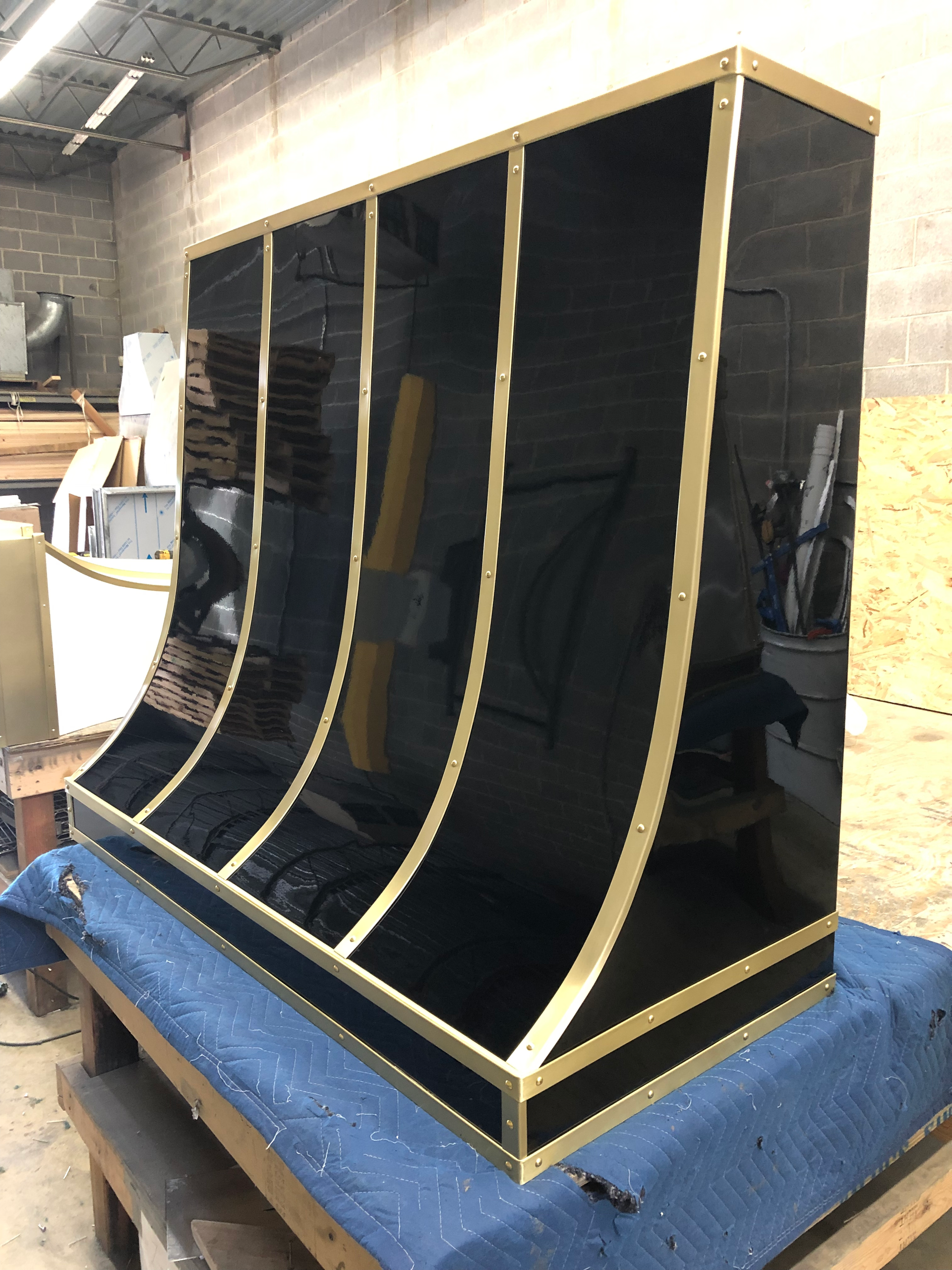 A black and gold item is sitting on a table