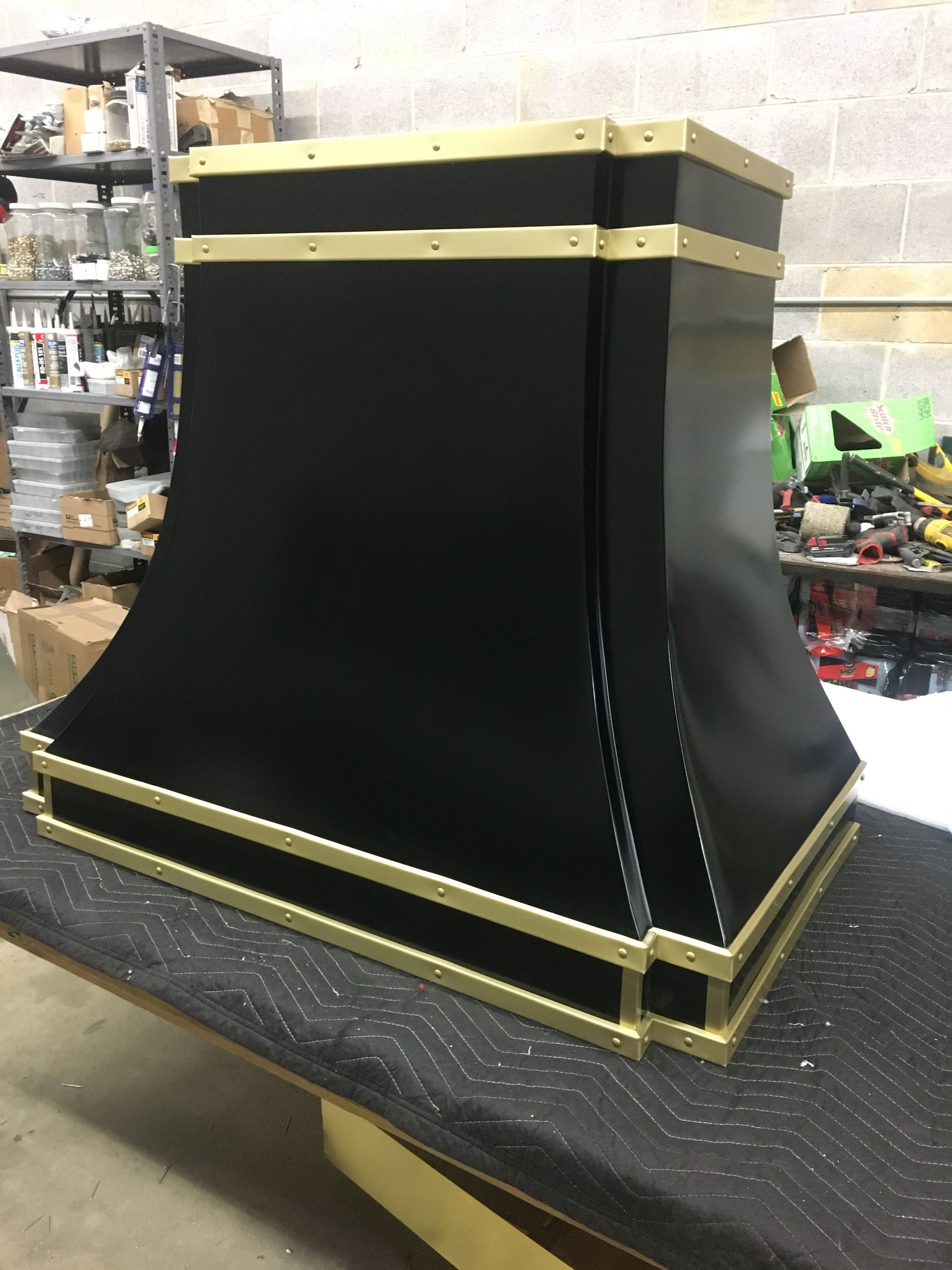 A black and gold item is sitting on a table