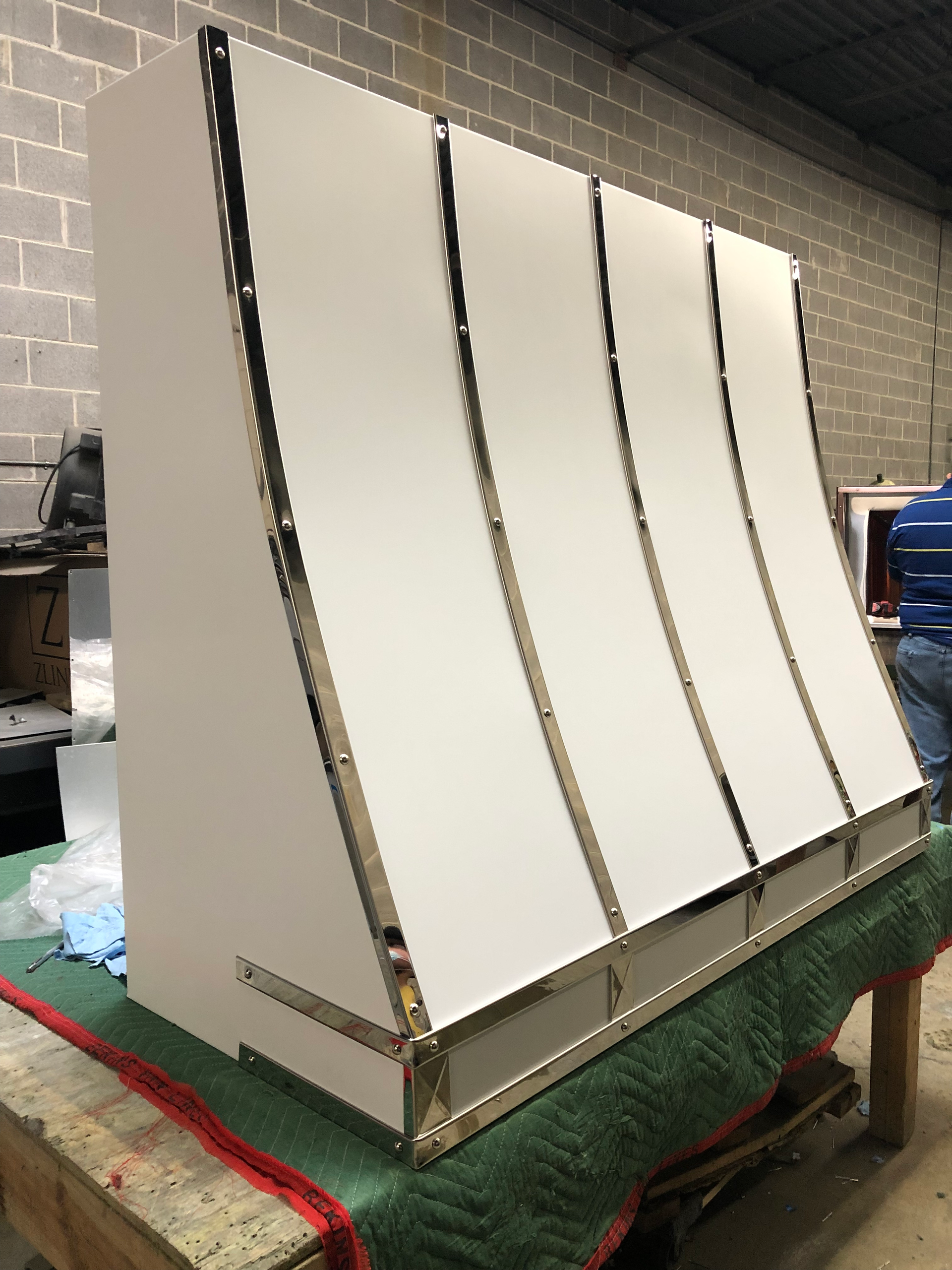 A white box is sitting on top of a green table.