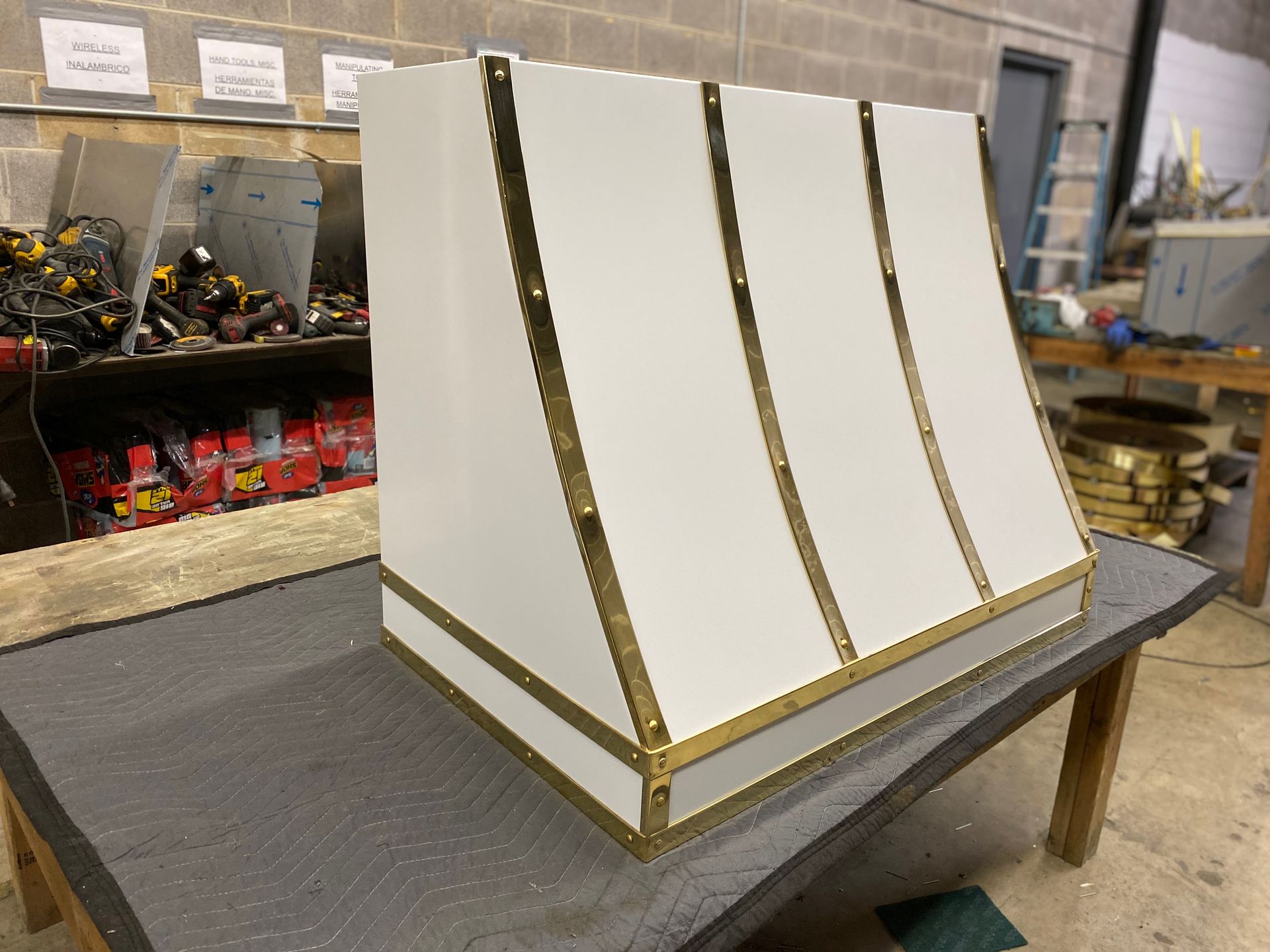 A white box with gold trim is sitting on a table.