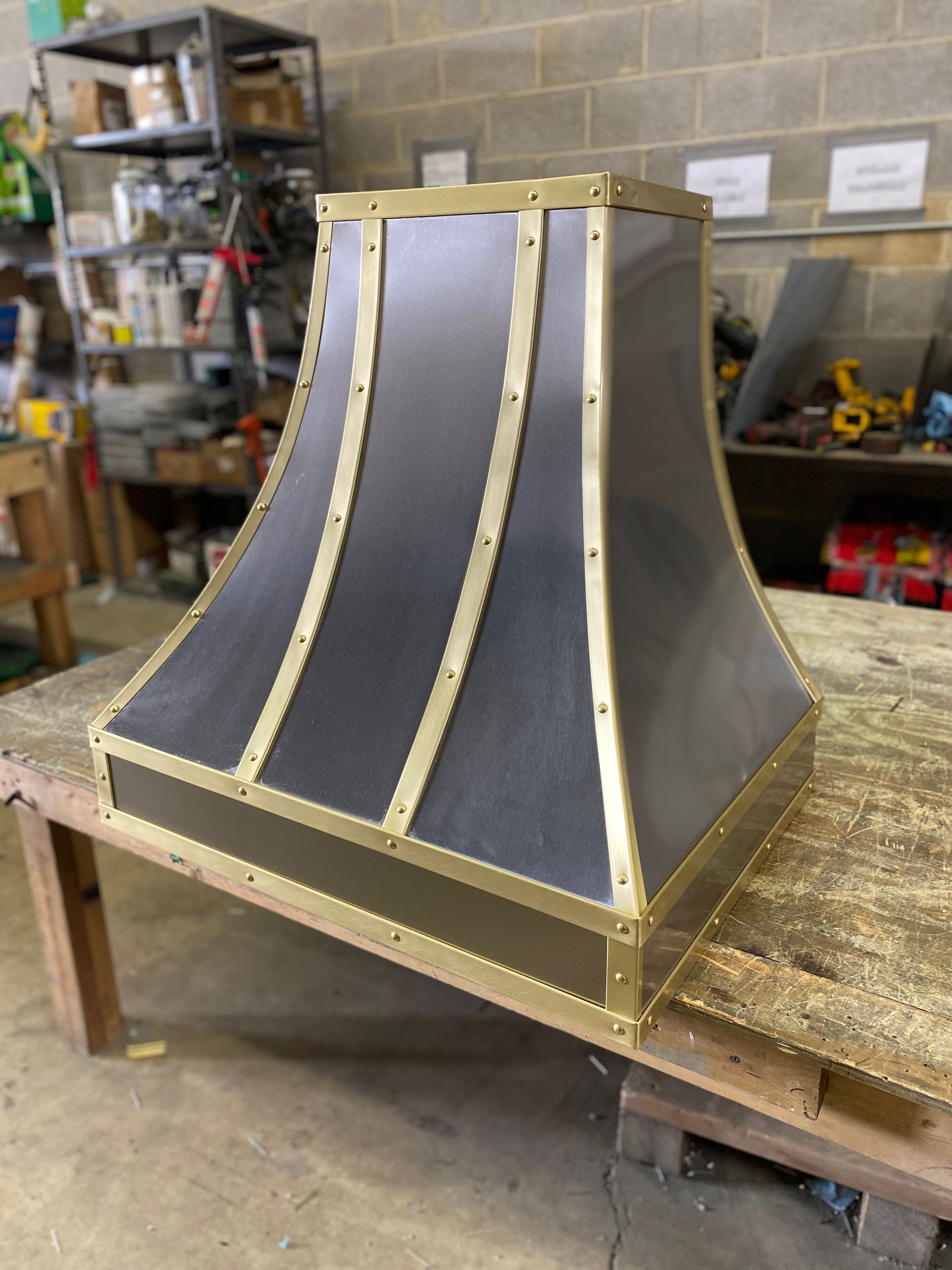 A lamp shade is sitting on top of a wooden table.