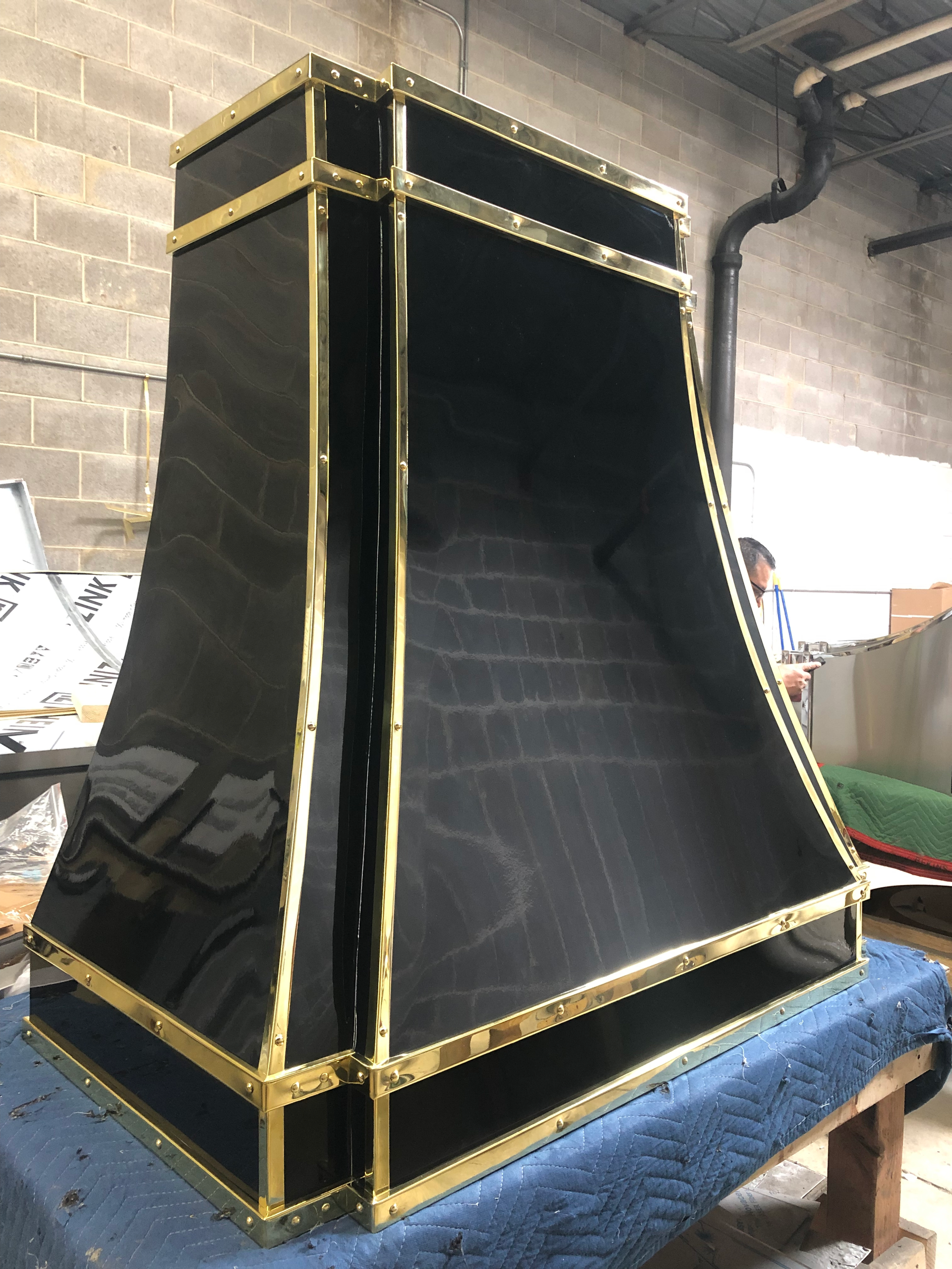 A black and gold item is sitting on a table