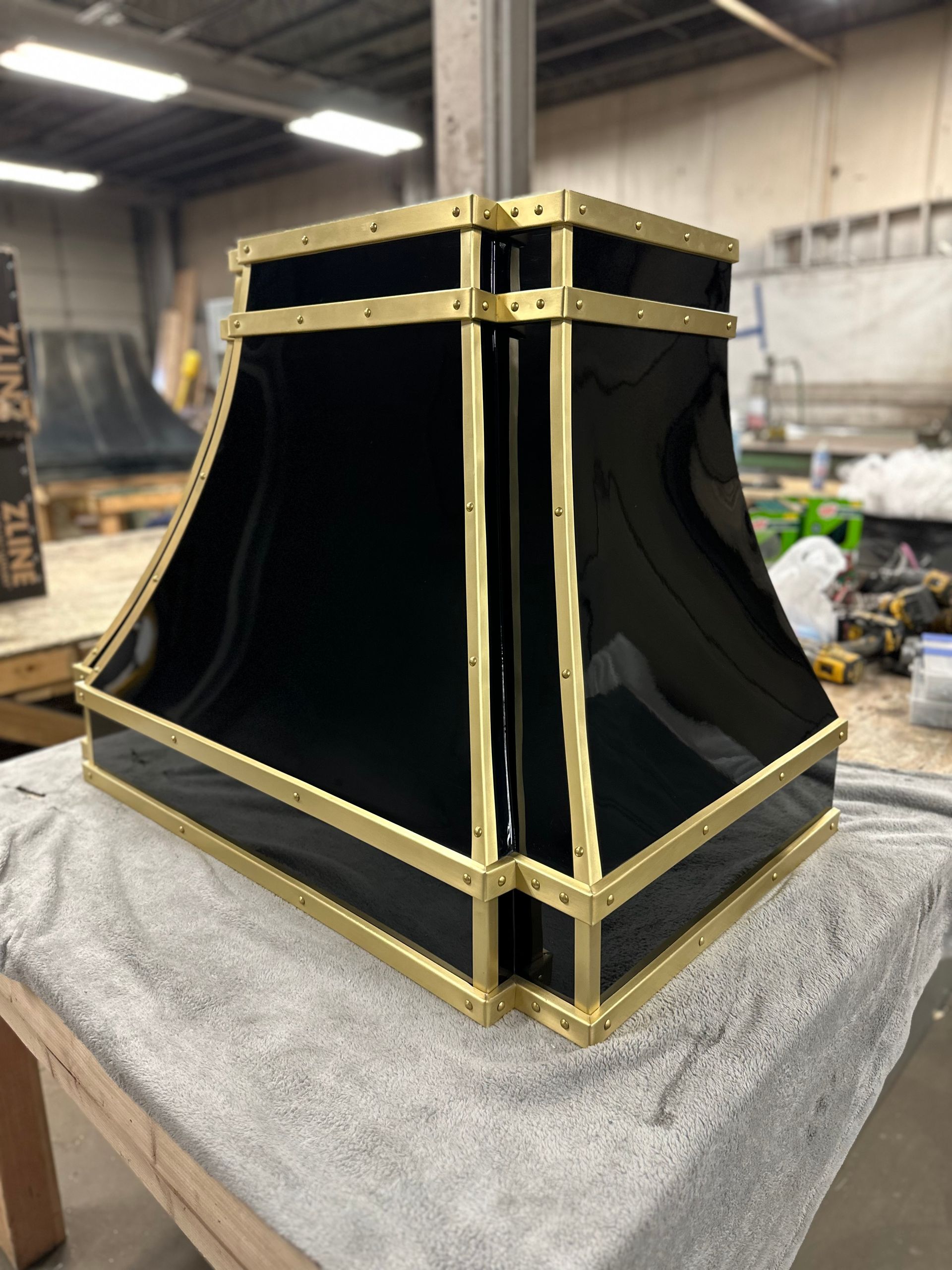 A black and gold object is sitting on a table
