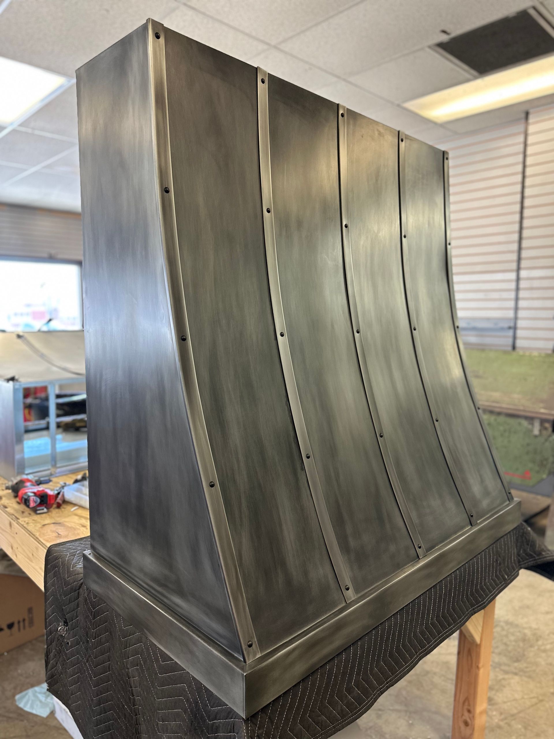 A large metal object is sitting on a table in a room