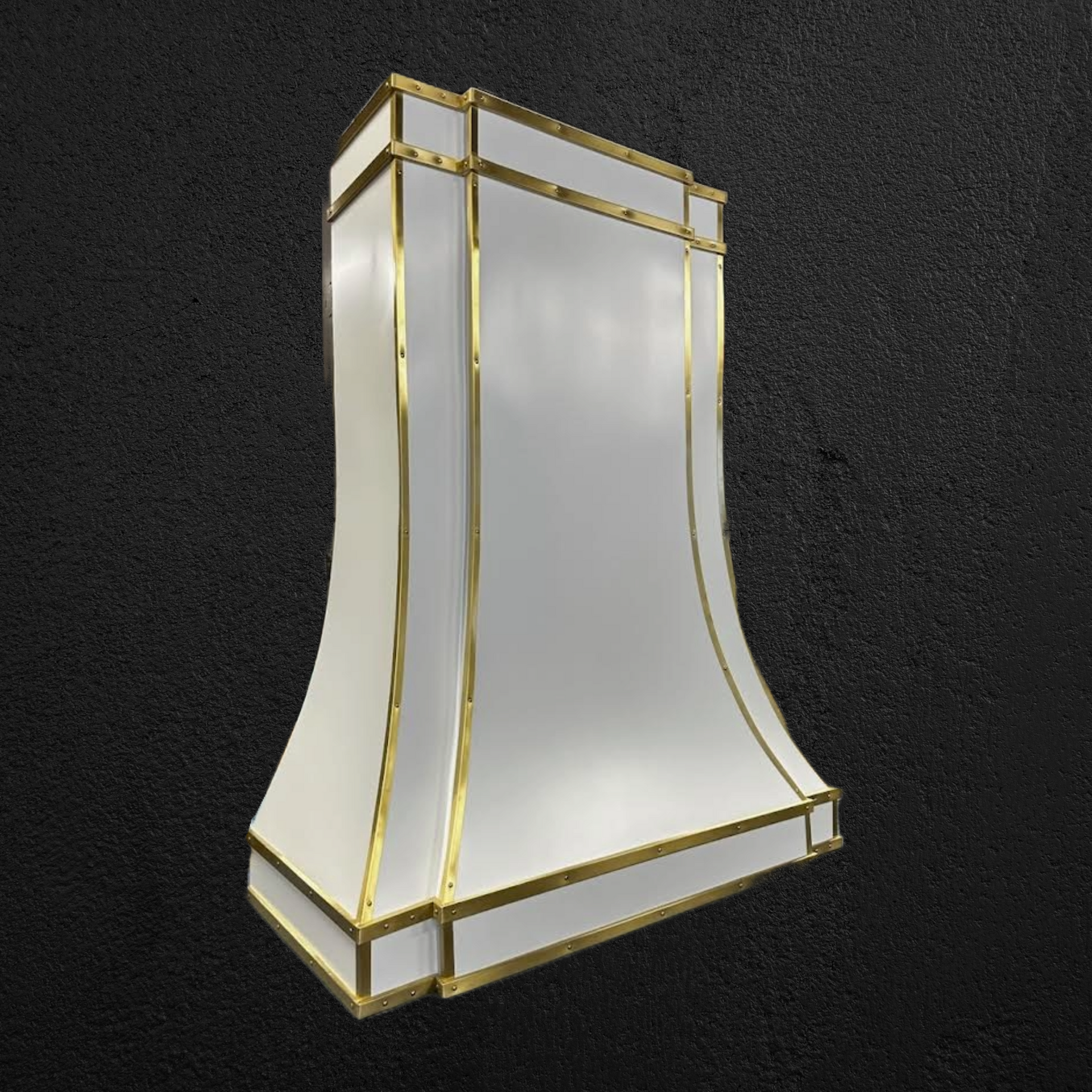 A white lamp shade with gold trim on a black background