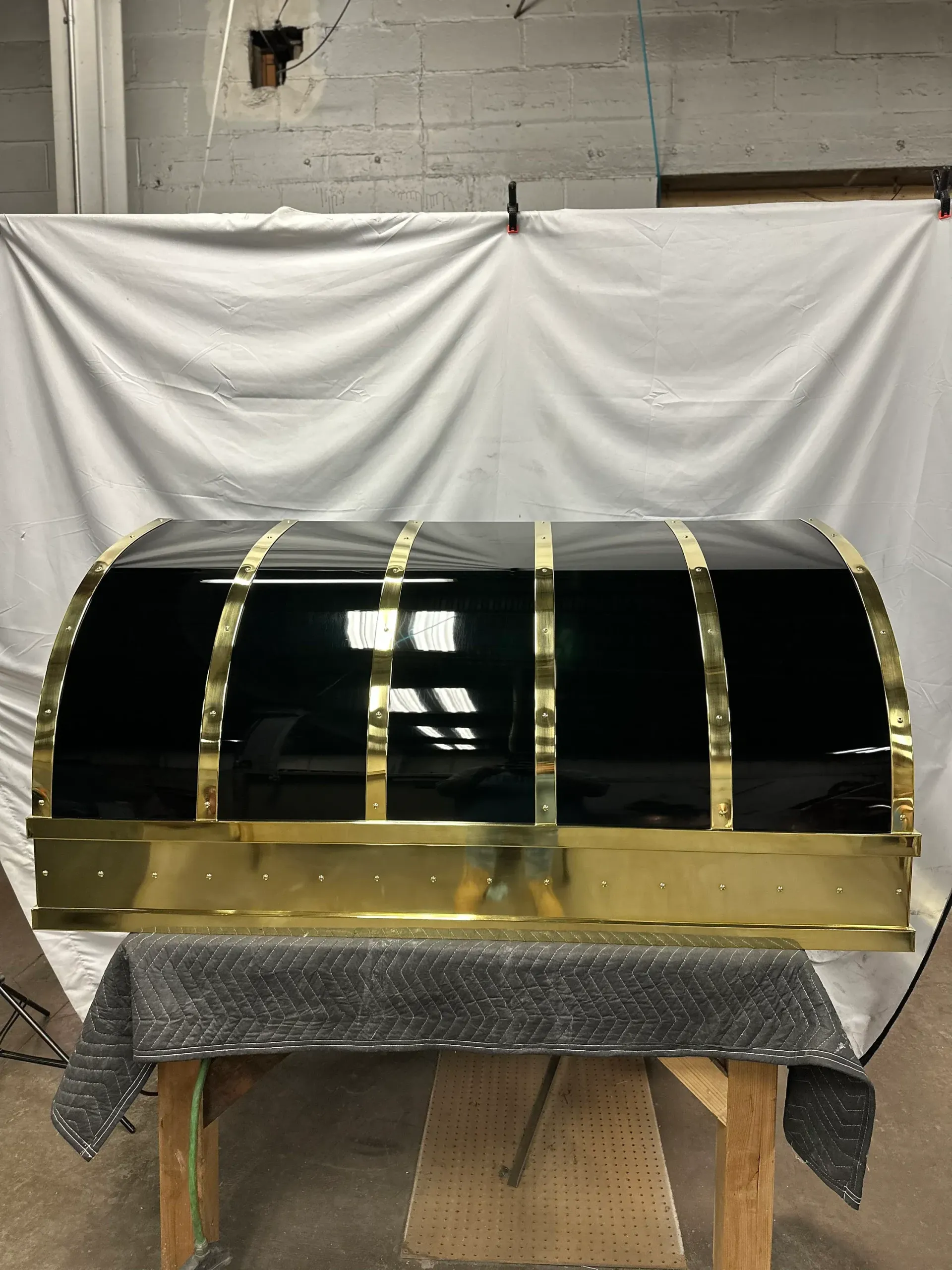 A black and gold object is sitting on a table