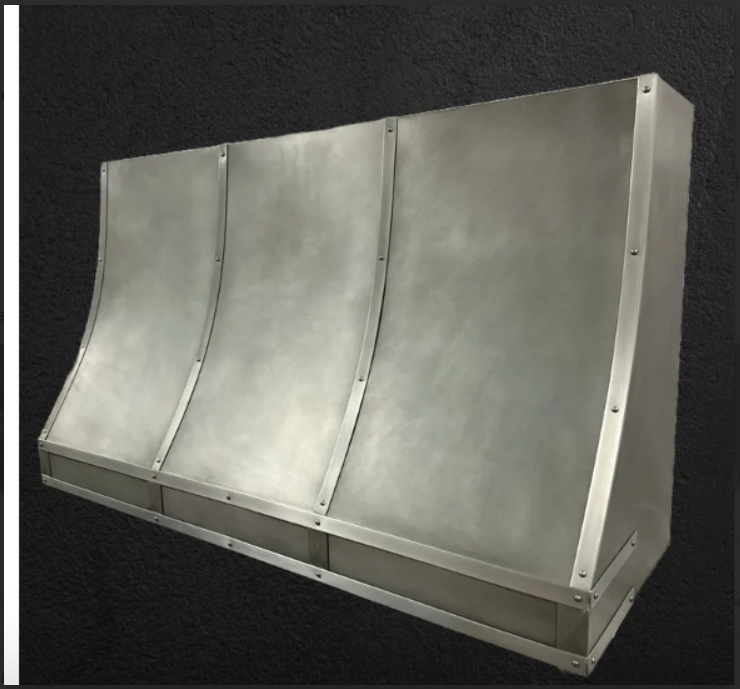 A stainless steel hood is sitting on a black surface