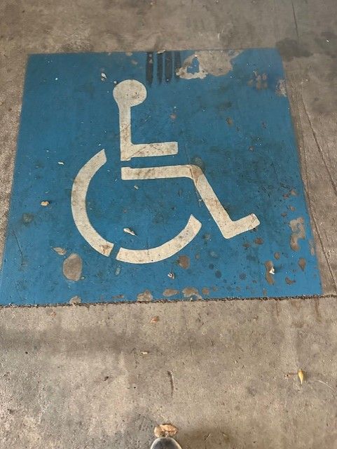 A Blue Sign With A White Wheelchair Symbol On It — Wide Bay Line Marking in Wondunna, QLD