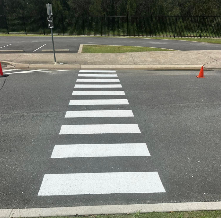 A Crosswalk Is Painted On The Side Of The Road — Wide Bay Line Marking in Wondunna, QLD