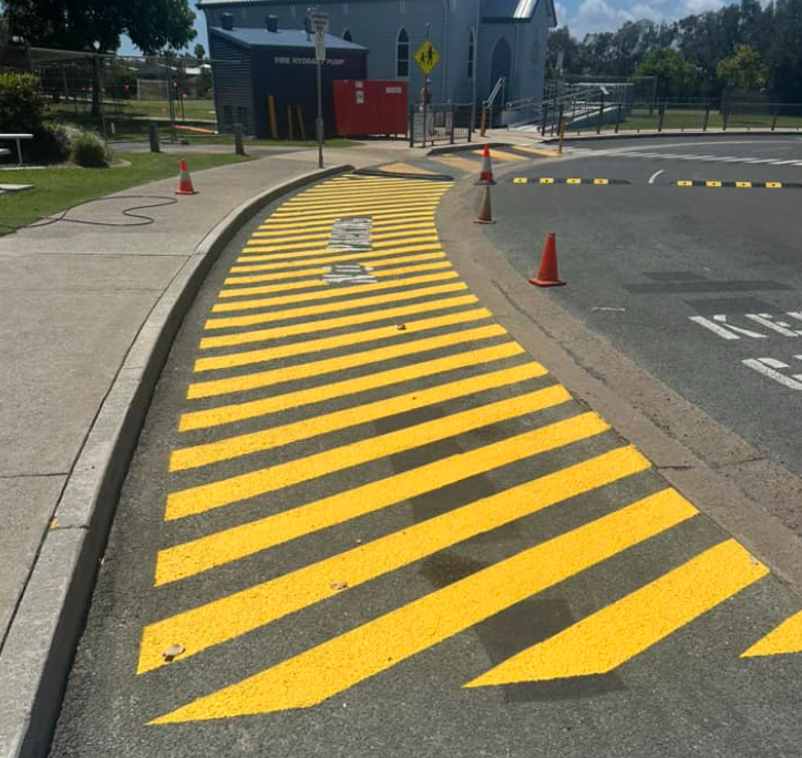 A Yellow And Black Striped Road With A Sign That Says No Parking — Wide Bay Line Marking in Wondunna, QLD