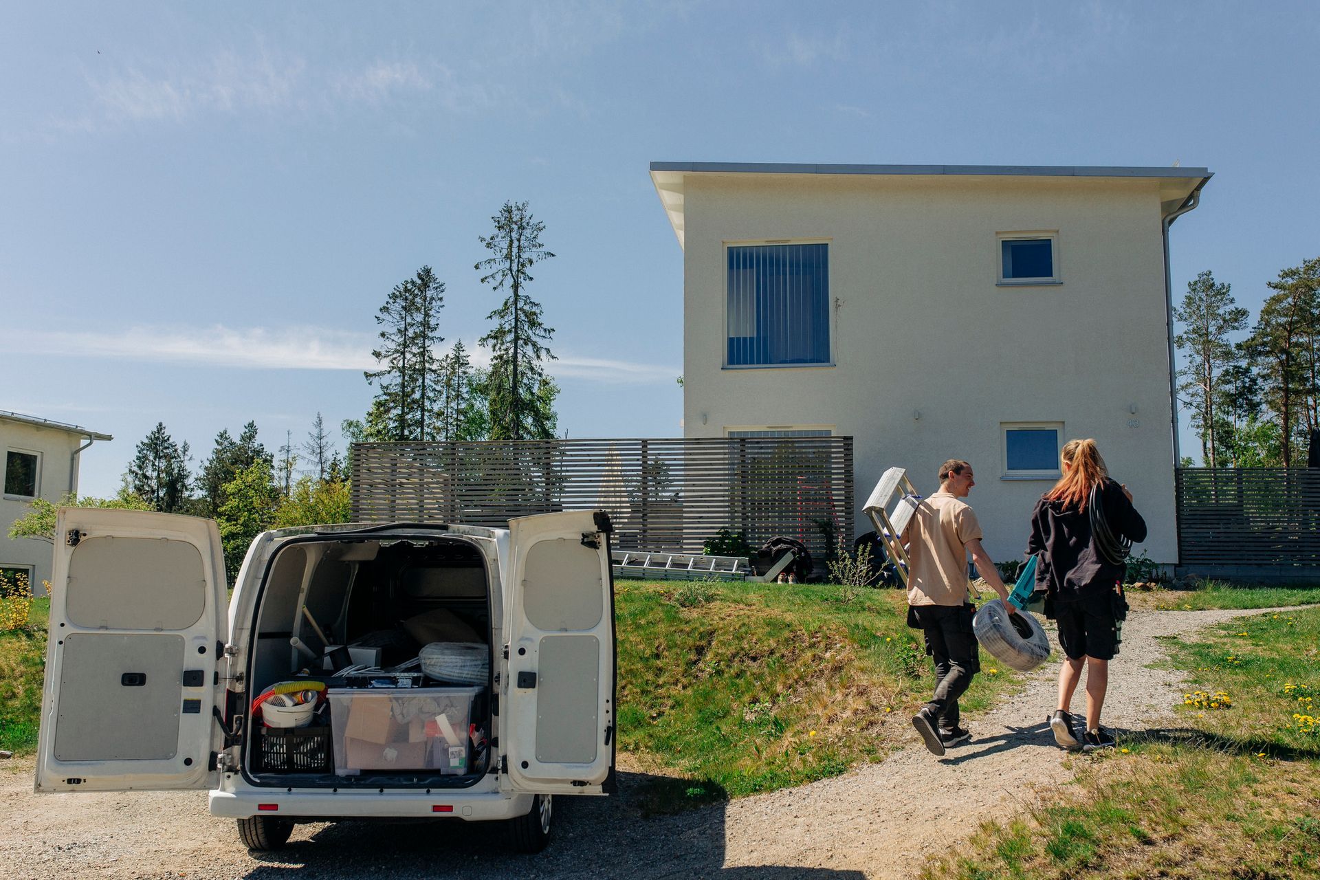 An electrician is going to the residential area