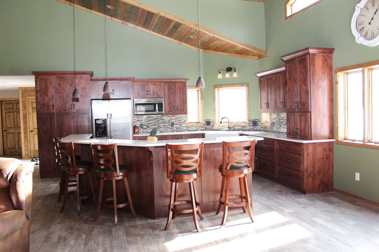 A large kitchen with a large island and stools