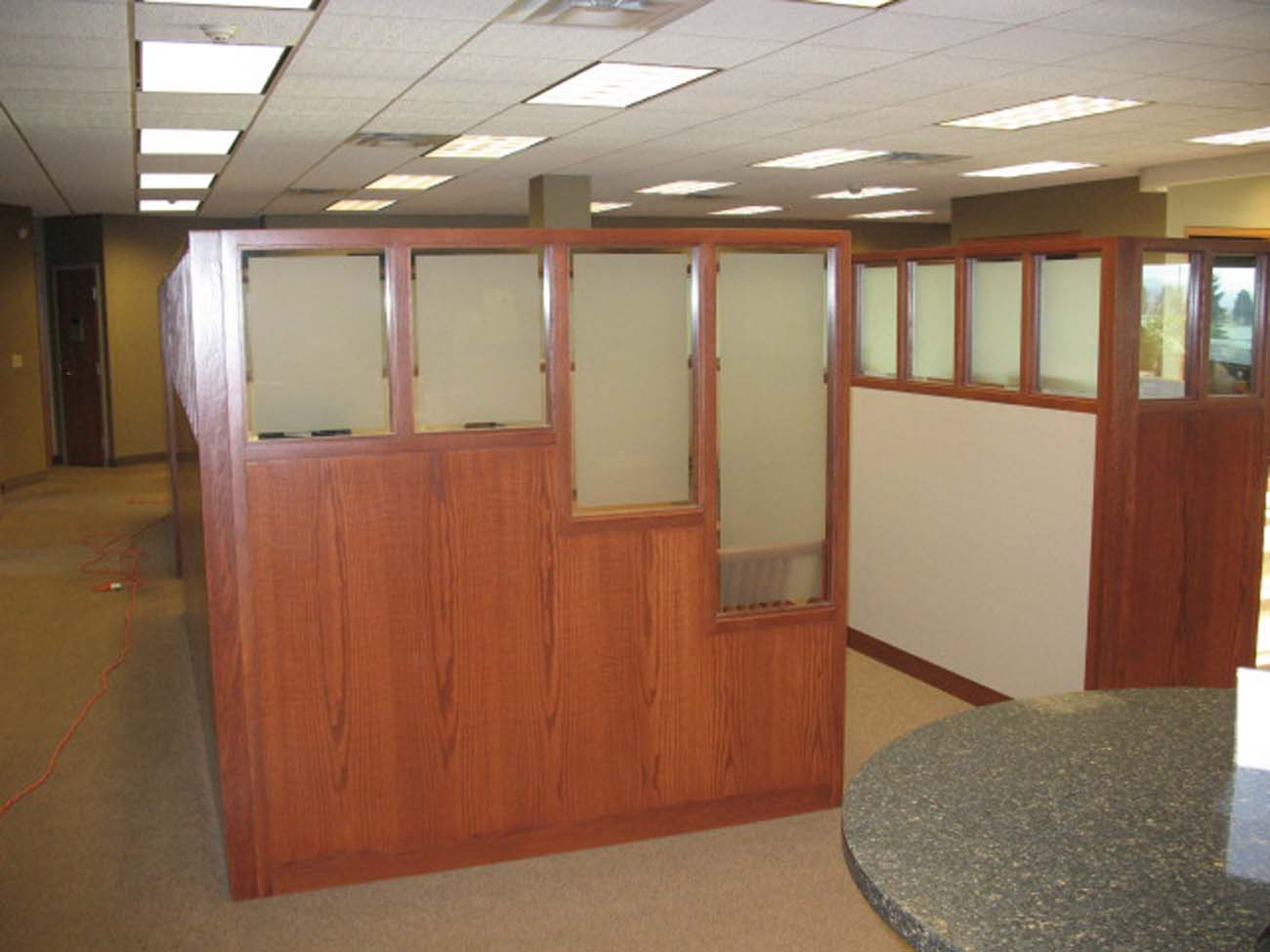 An office with cubicles and a round table