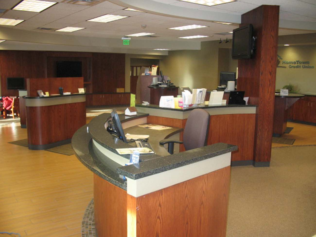 A reception area in a hospital with a curved counter