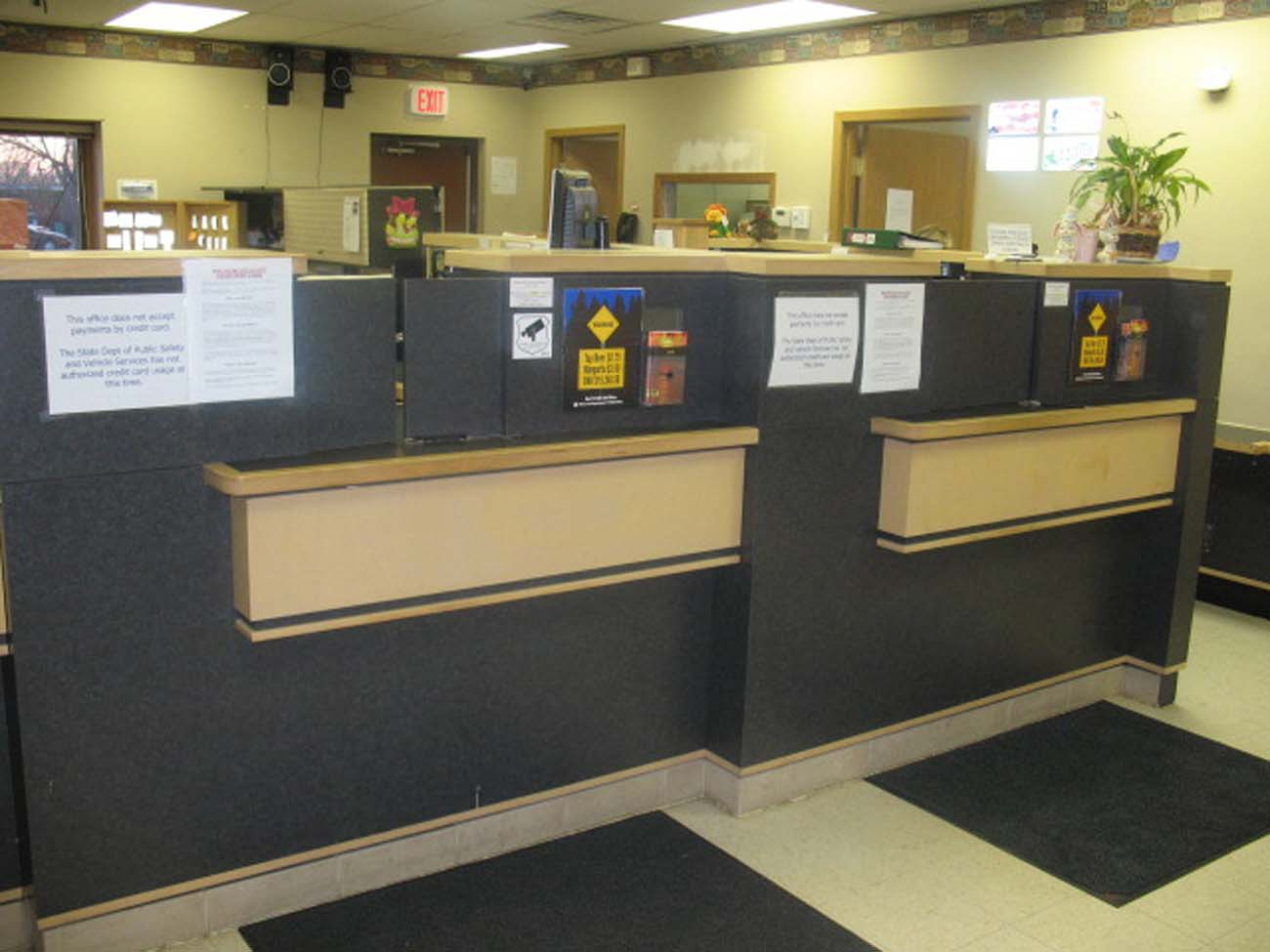 A bank with a sign that says exit on it