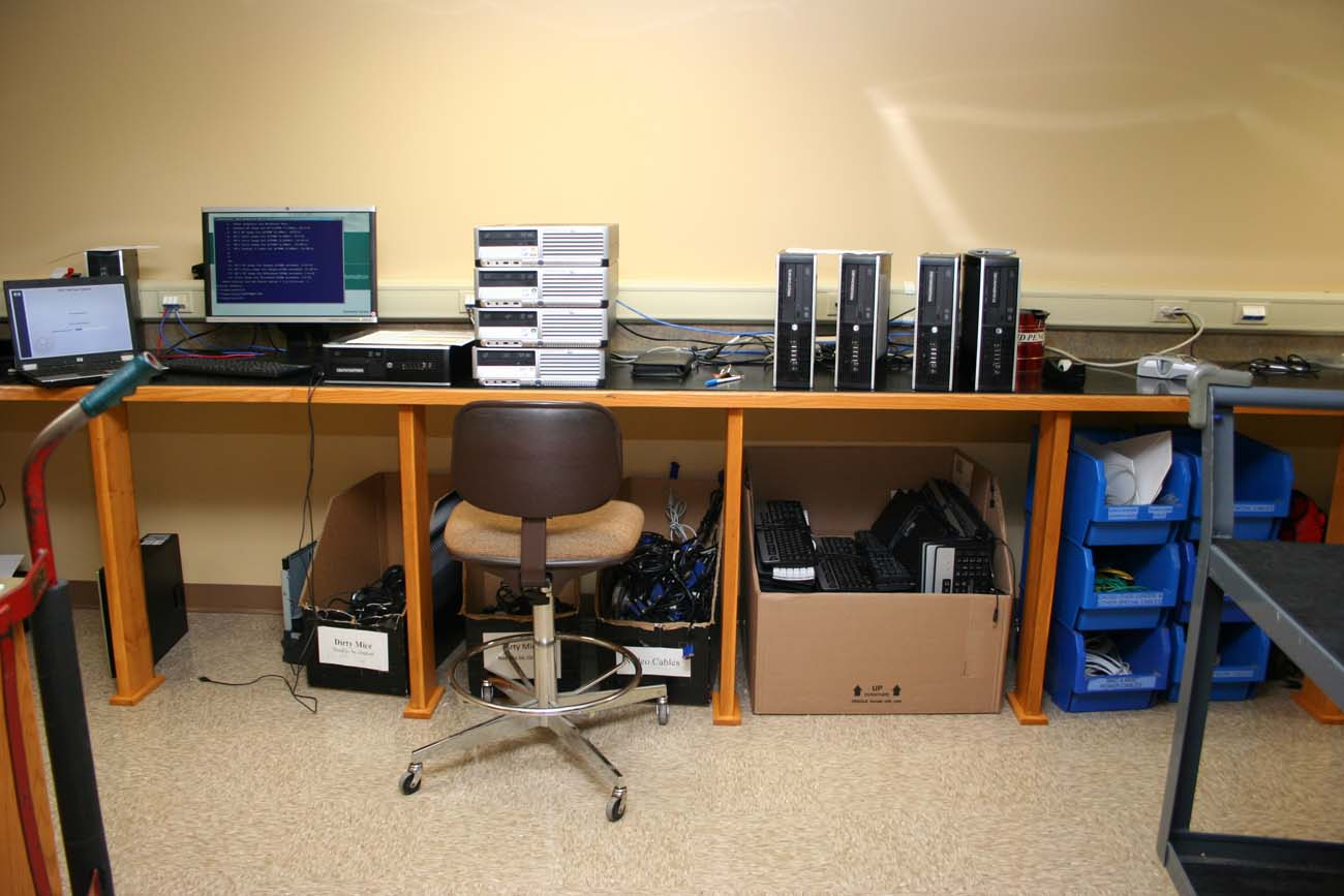 A desk with a chair and a computer on it