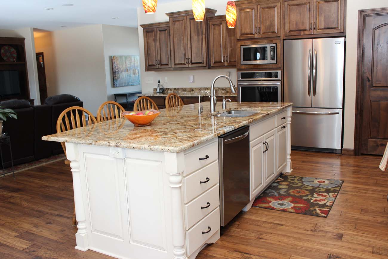 There is a large island in the middle of the kitchen.