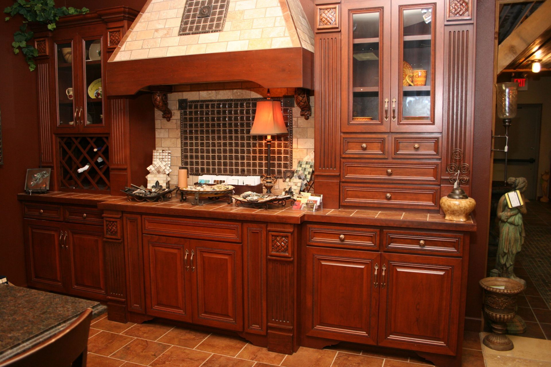 A kitchen with wooden cabinets and a brick hood