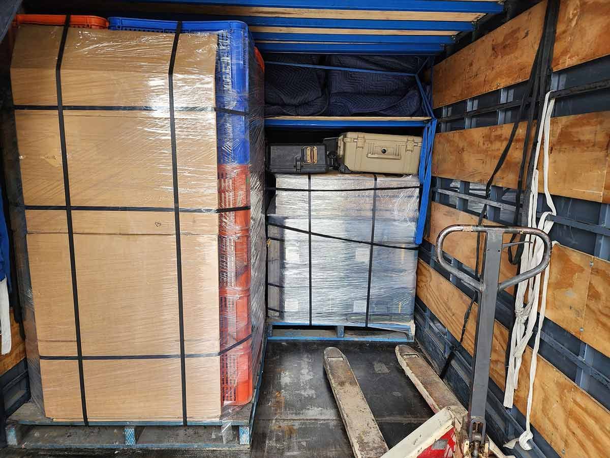 The Inside Of A Truck Filled With Boxes And Pallets — Gordy's Furniture Removals in Kelso, NSW