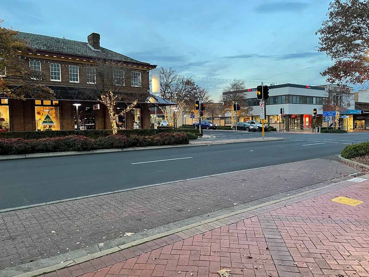 A City Street With A Brick Sidewalk And A Building In The Background — Gordy's Furniture Removals in Orange, NSW