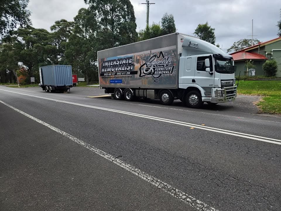 A Van Is Parked On The Side Of The Road At Sunset — Gordy's Furniture Removals in Yass, NSW