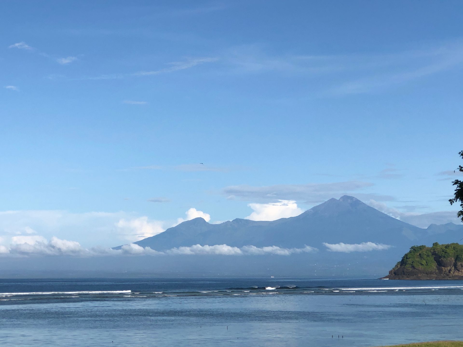 A large body of water with mountains in the background