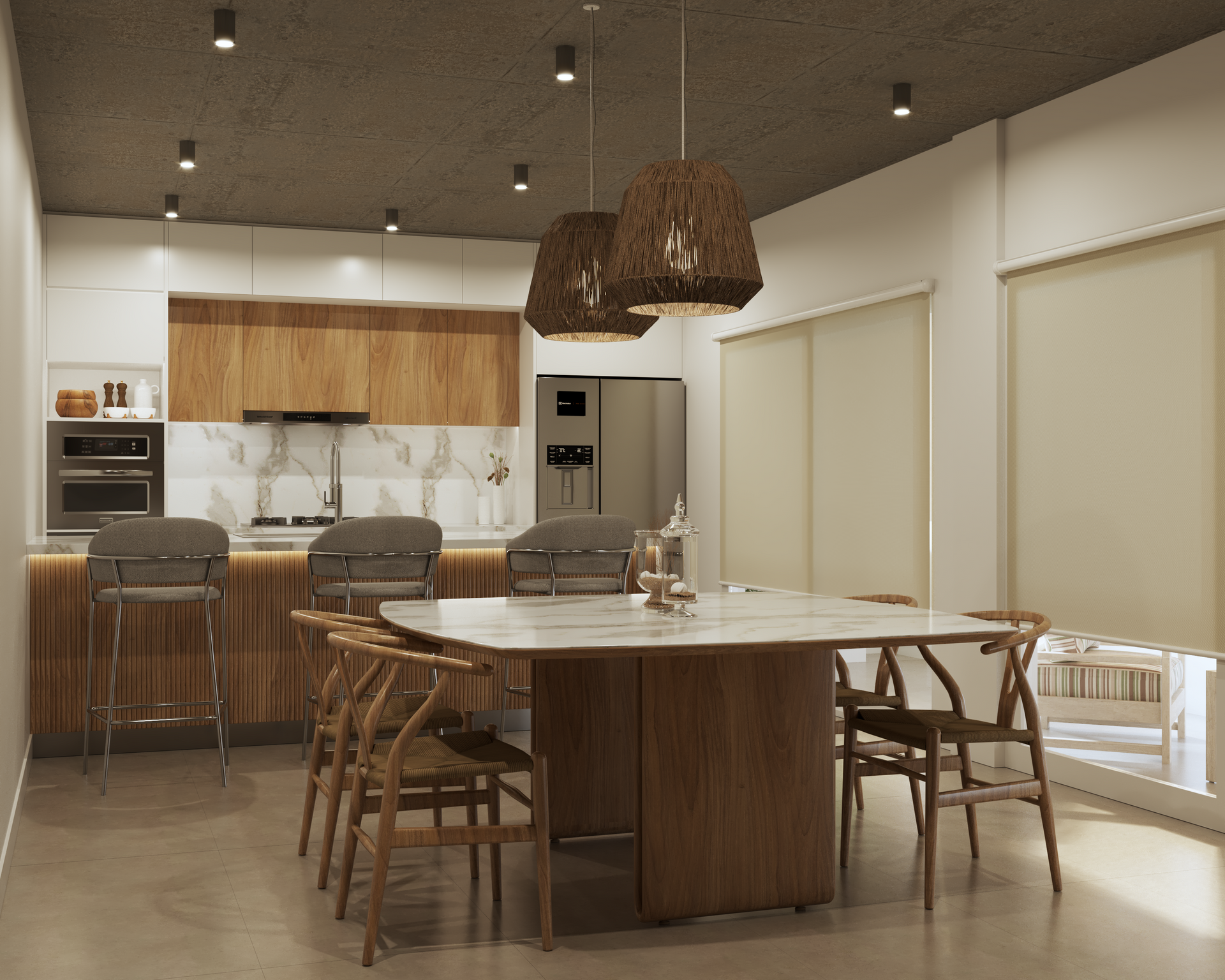 Una cocina moderna con comedor. Elementos de madera y blanco; lámparas colgantes sobre una mesa de mármol.