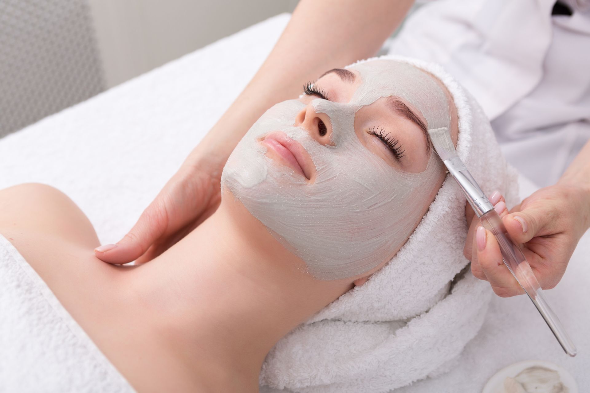 a woman is getting a facial treatment at a spa