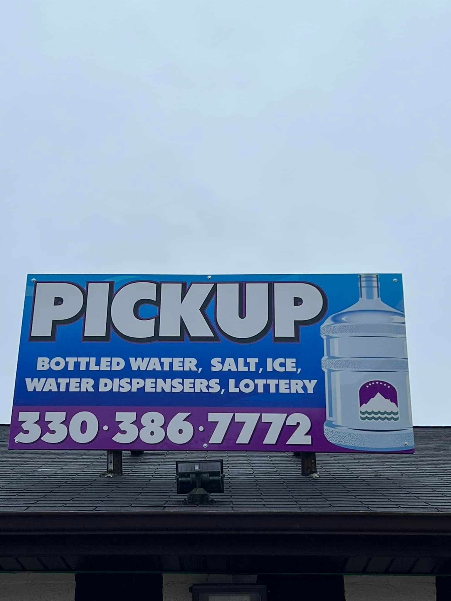 Sign on a building's roof advertising 