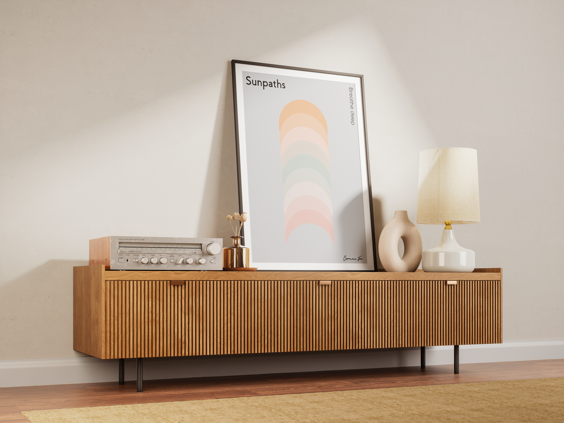 Wooden cabinet with a poster, lamp, and decorations against a cream wall.