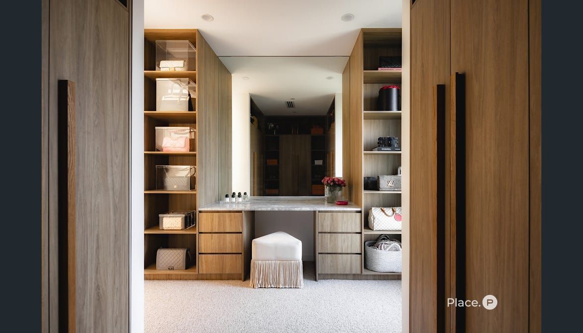 Walk-in Closet With Light Wood Shelving — Foreshore Kitchens in Coolum Beach, QLD