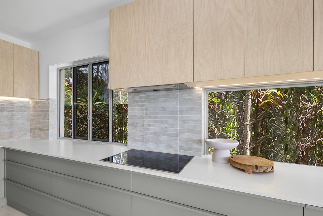 Modern Kitchen With Light Wood Cabinets — Foreshore Kitchens in Maroochydore, QLD