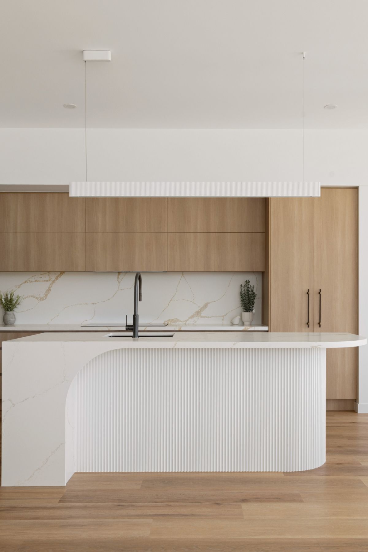 A Modern Kitchen With Light Wood Cabinets — Foreshore Kitchens in Nambour, QLD
