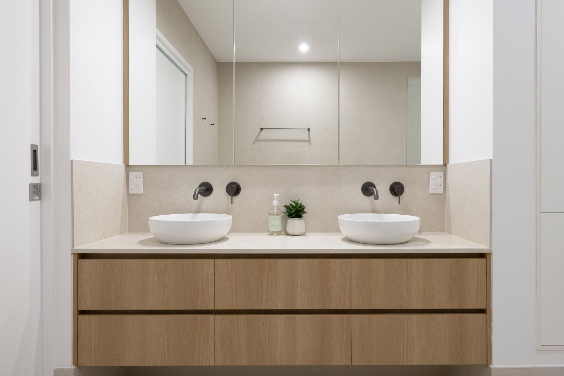A Modern Bathroom Vanity With Two White Bowl Sinks — Foreshore Kitchens in Coolum, QLD
