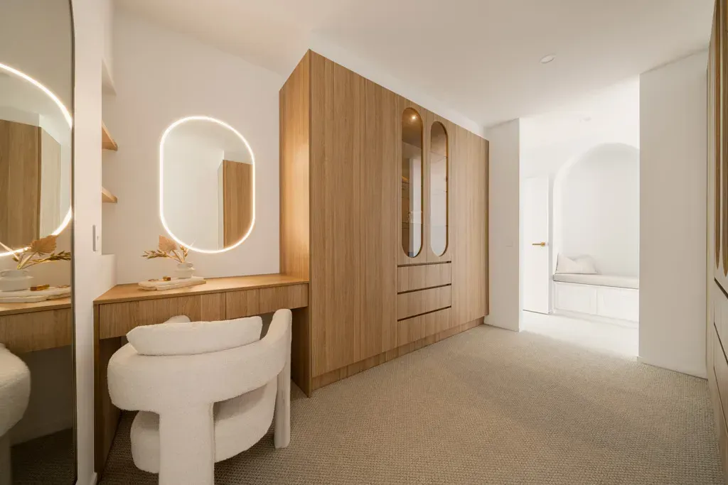 Modern, Light-filled Bedroom With a Wooden Wardrobe — Foreshore Kitchens in Noosa, QLD