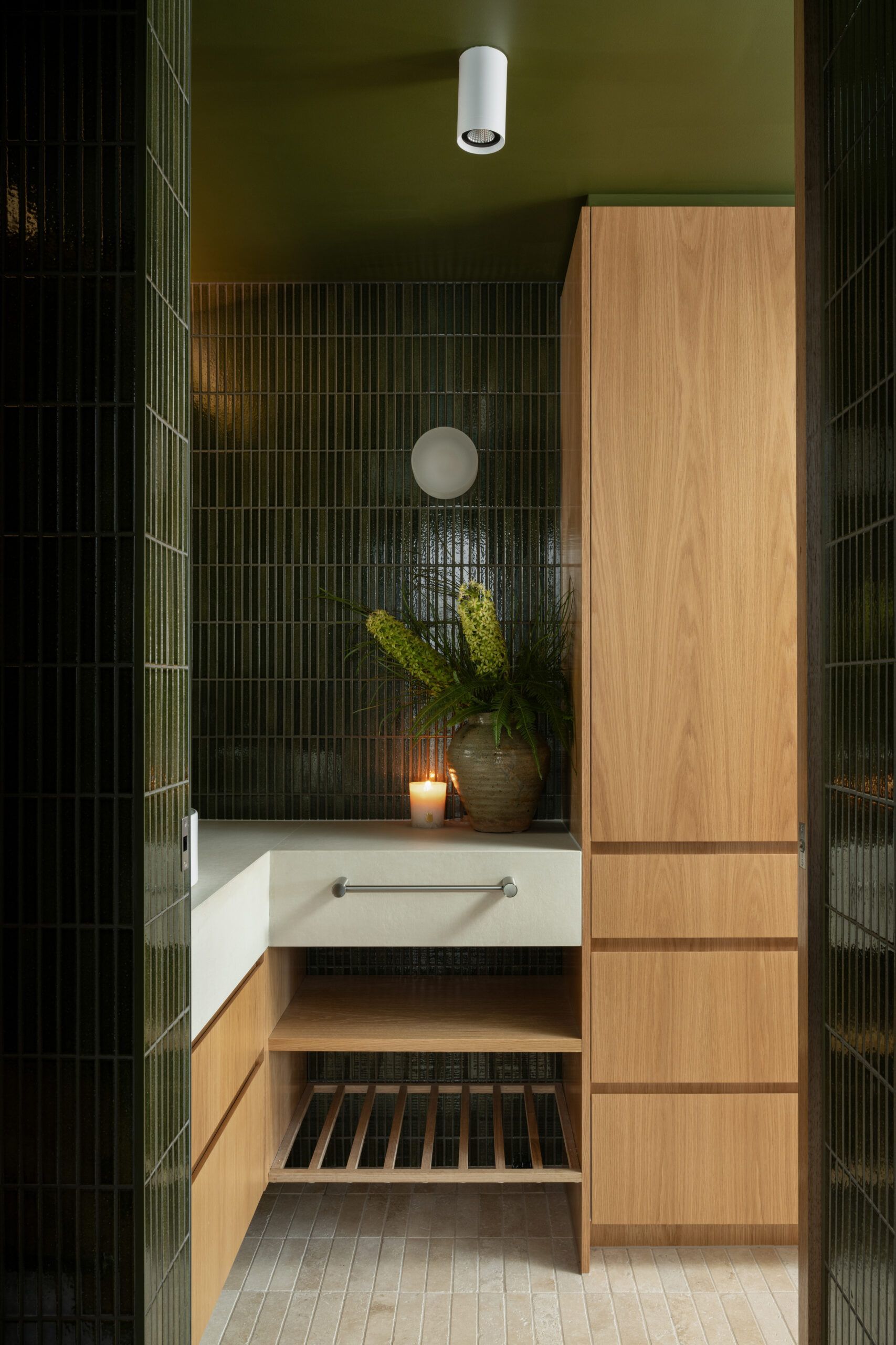 A Modern Bathroom Vanity Area With Green Tiled Walls — Foreshore Kitchens in Maroochydore, QLD
