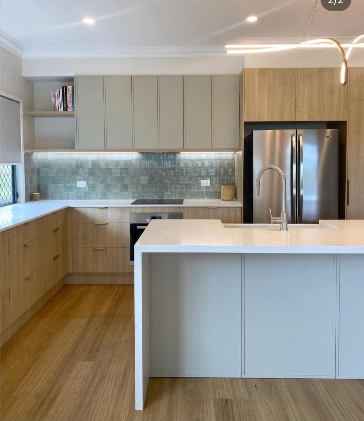 Modern Kitchen With Light Wood Lower Cabinets — Foreshore Kitchens in Noosa, QLD