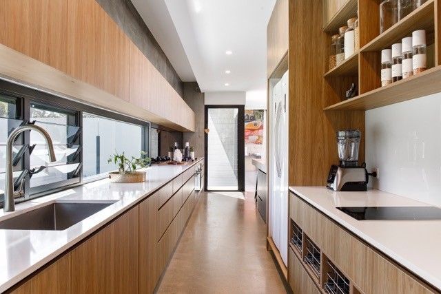Modern Galley Kitchen Featuring Light Wood Cabinetry — Foreshore Kitchens in Noosa, QLD