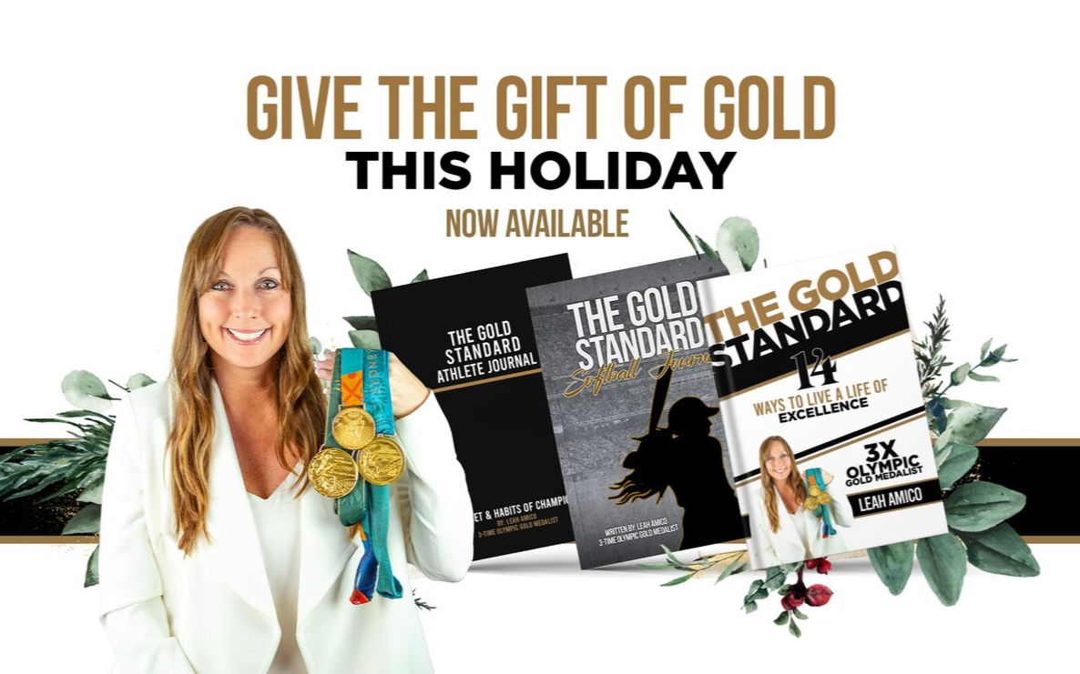 Leah Amico holding her gold medals, books titled