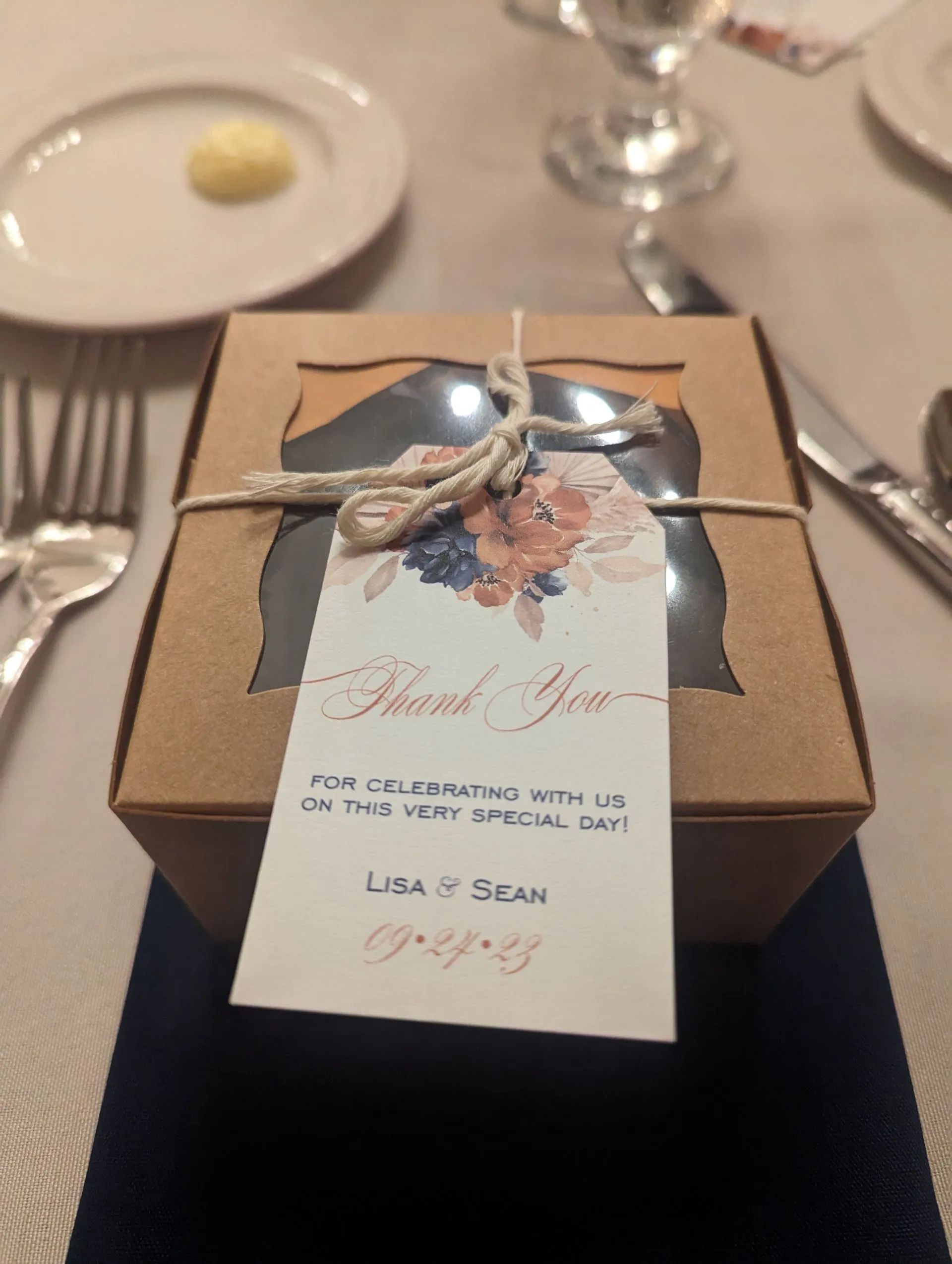 A box with a thank you tag attached to it