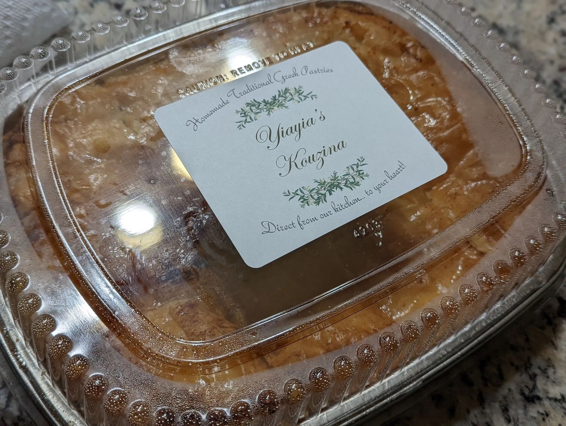 A plastic container with a label that says ' kristin ' on it