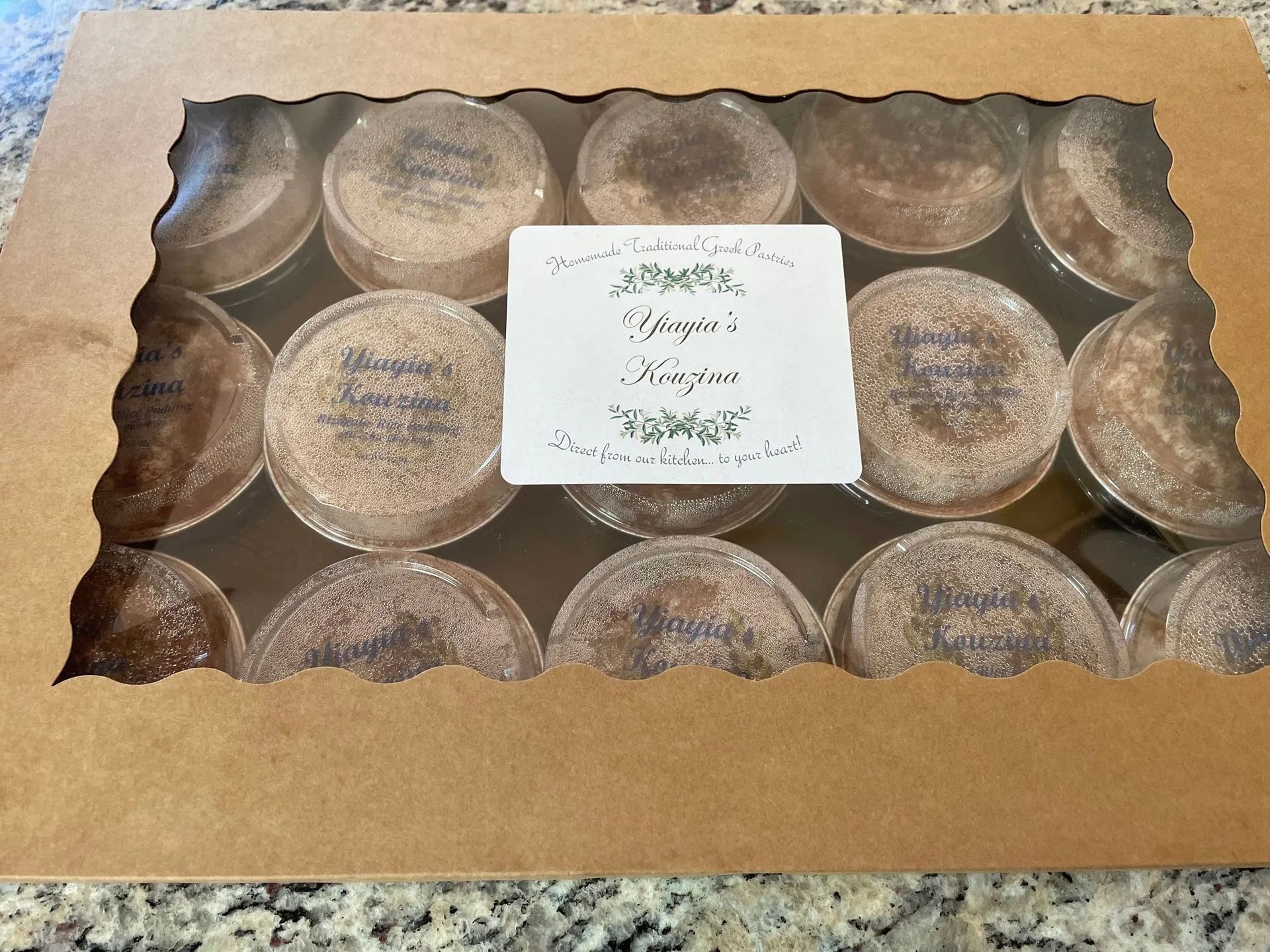 A box of cupcakes with a label that says ' magic ' on it