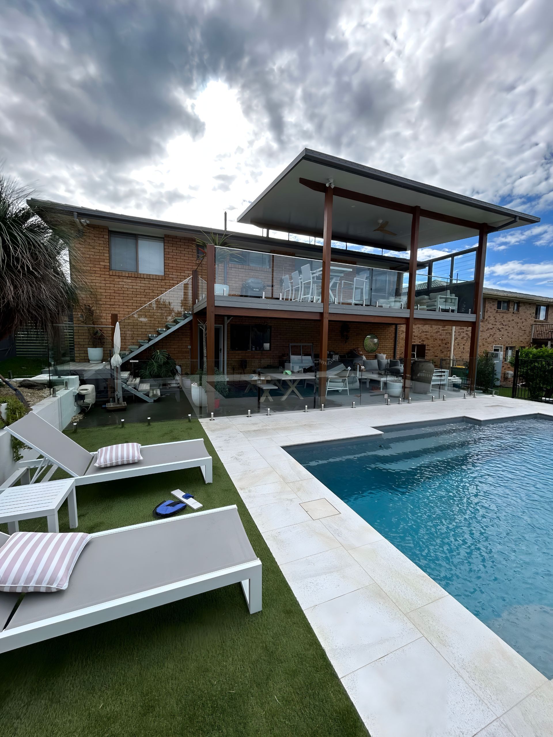 A Two-Story Brick Home with A Pool — Envy Glass in Nambucca Heads, NSW