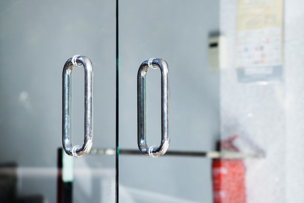 Glass door with two silver handles — Envy Glass in Nambucca Heads, NSW