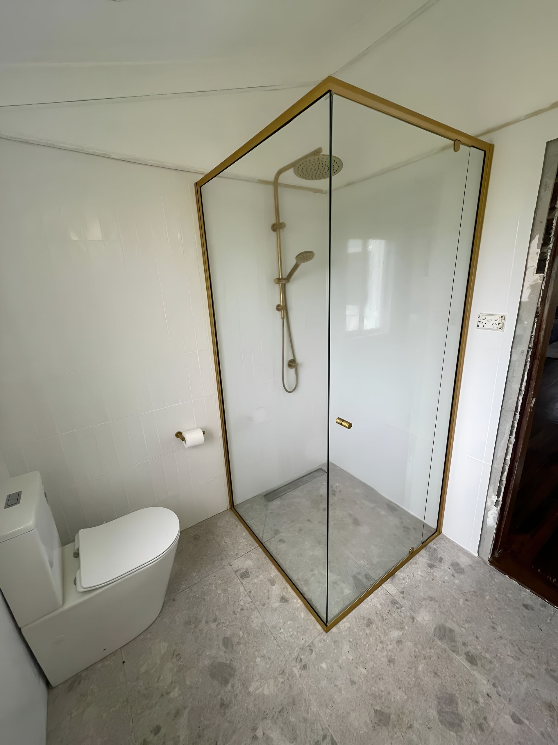 Bathroom with A Gold-Framed Glass Shower — Envy Glass in Nambucca Heads, NSW