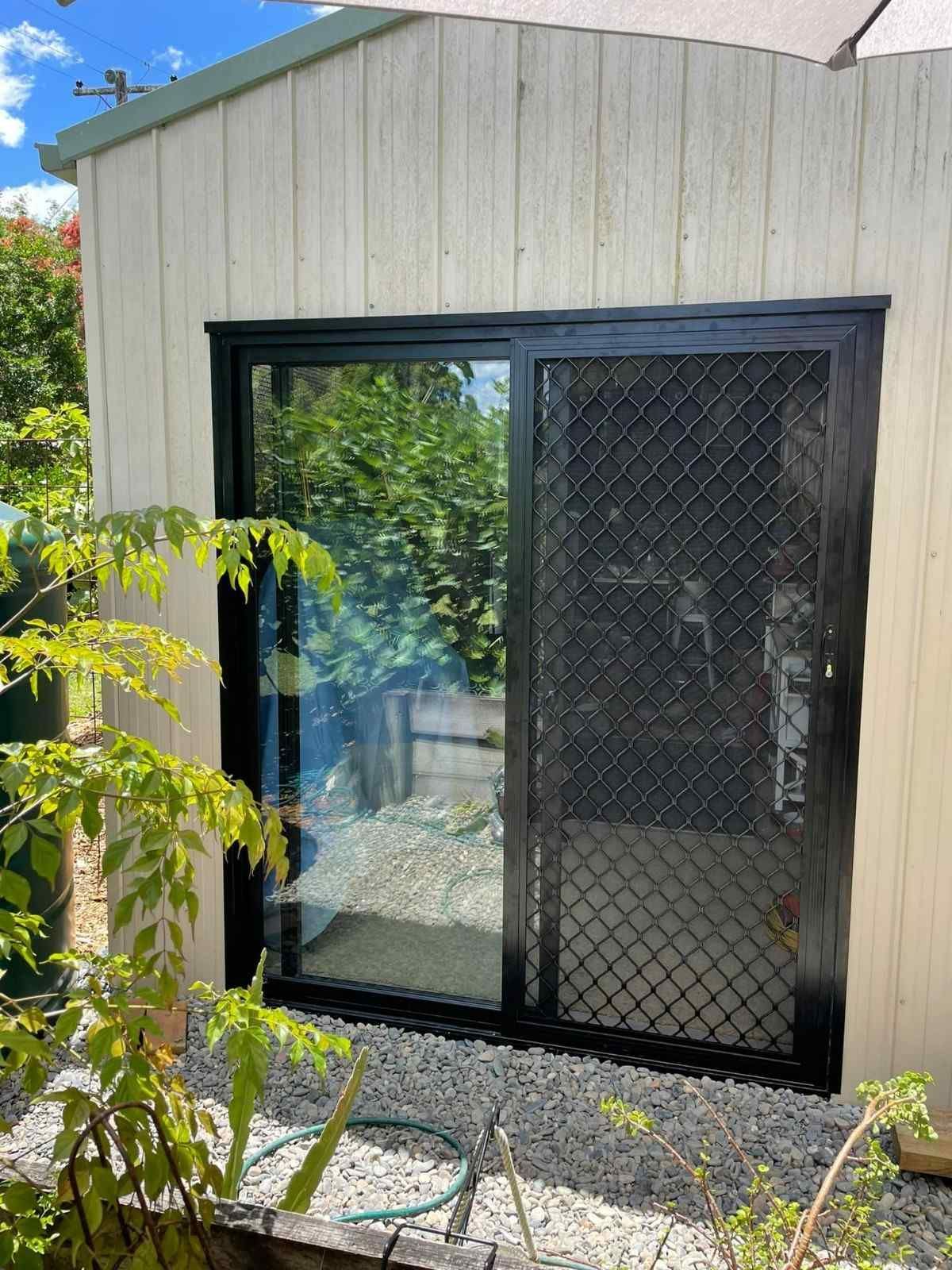 A Sliding Glass Door with Security Screen — Envy Glass in Nambucca Heads, NSW