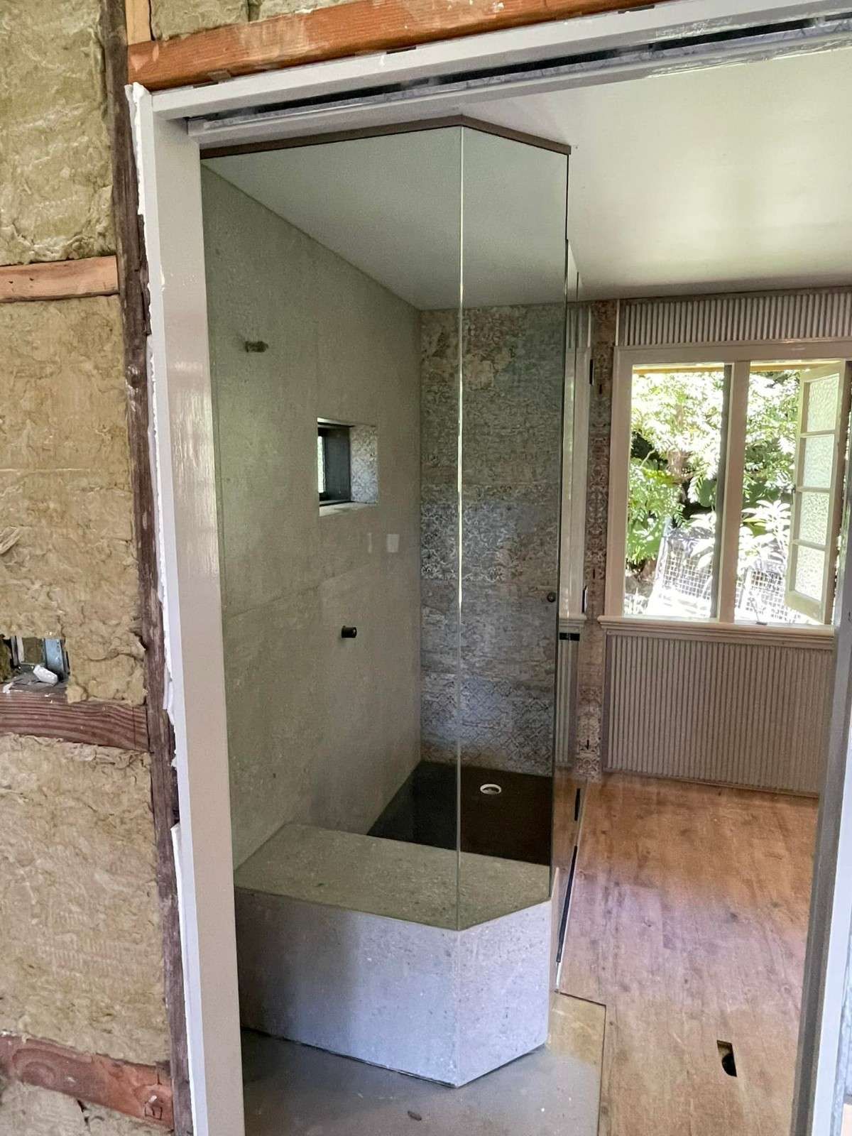 A Shower Stall with Glass Door and Bench — Envy Glass in Urunga, NSW