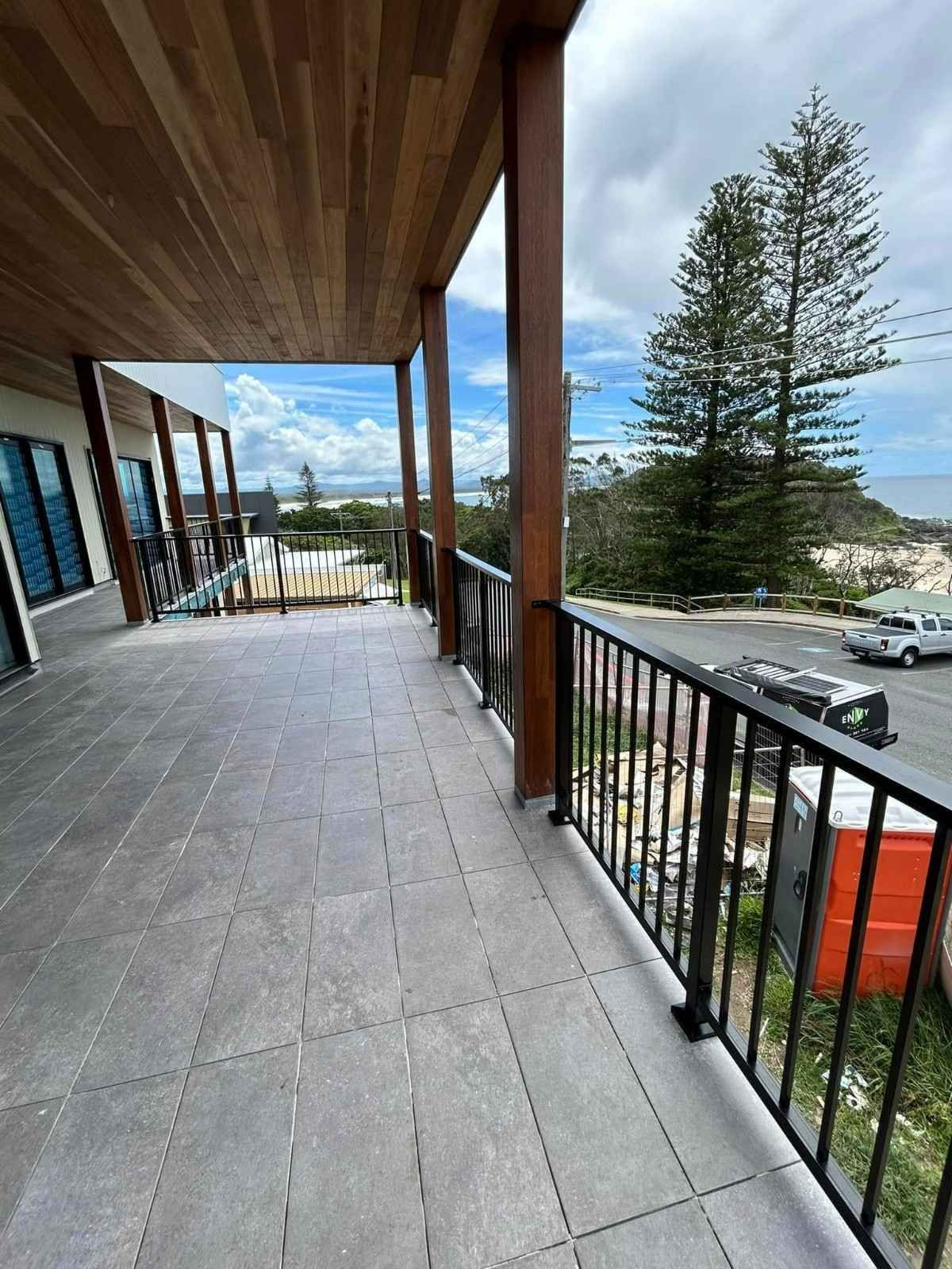 A Balcony with Black Railing — Envy Glass in Nambucca Heads, NSW
