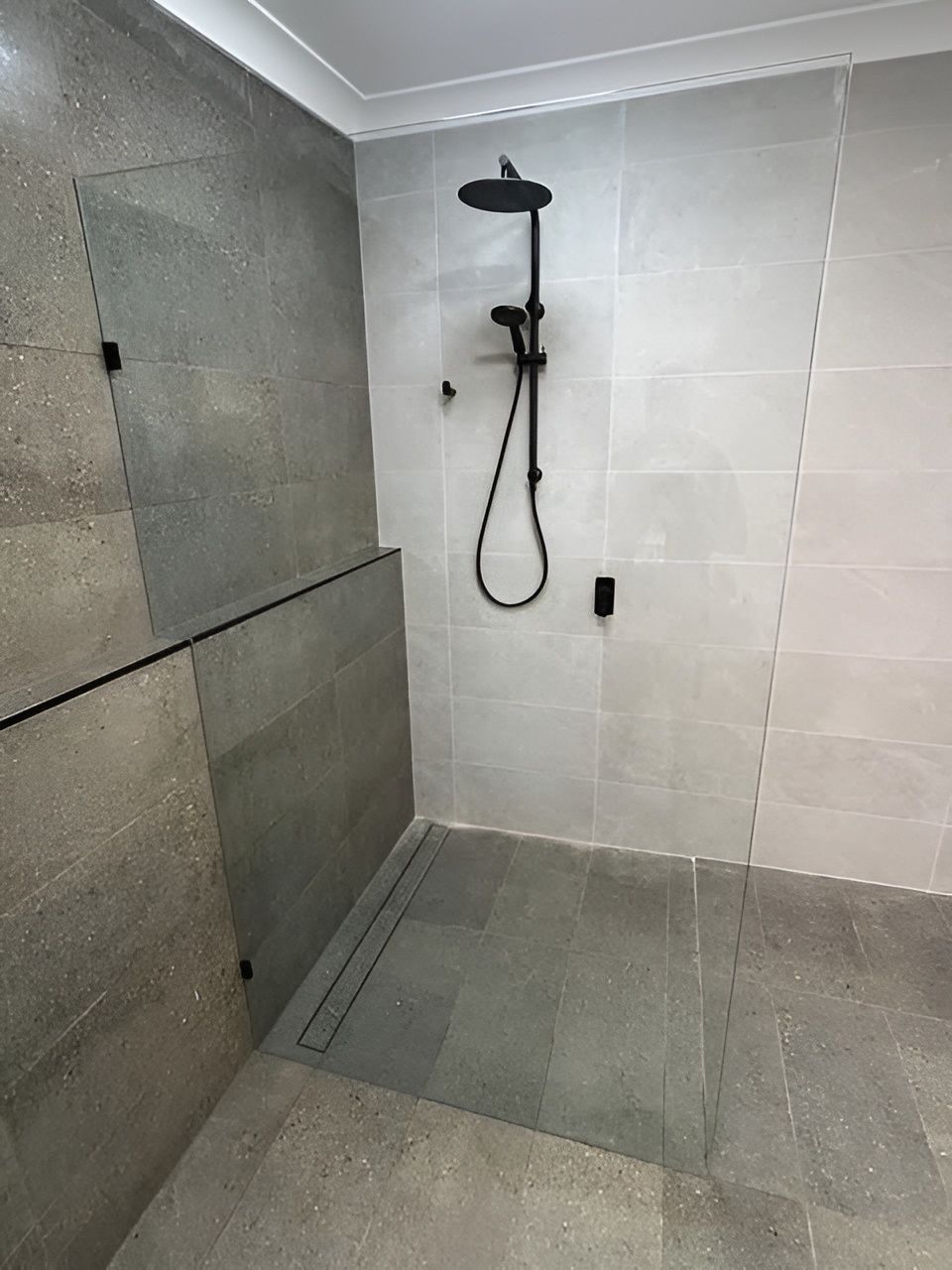 Modern Shower with Black Fixtures, Gray Tile Walls and Floor — Envy Glass in Nambucca Heads, NSW